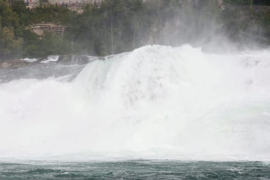 Waterfall with white,foaming spray