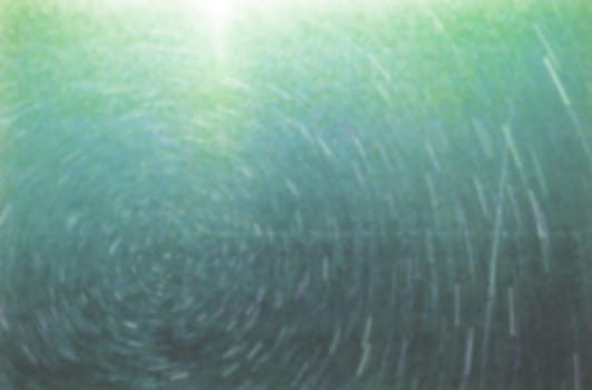 concentric circle abstract pattern on green and blue background