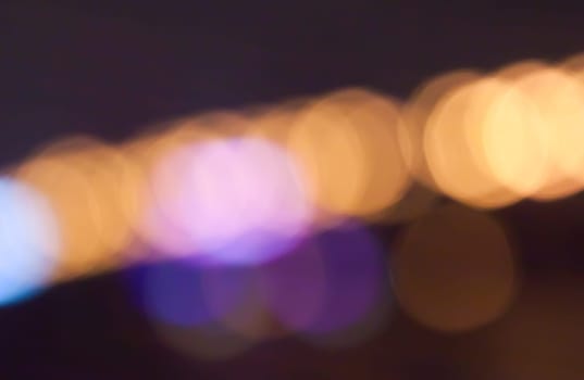 blurred street bokeh with warm colorful lights for background usage