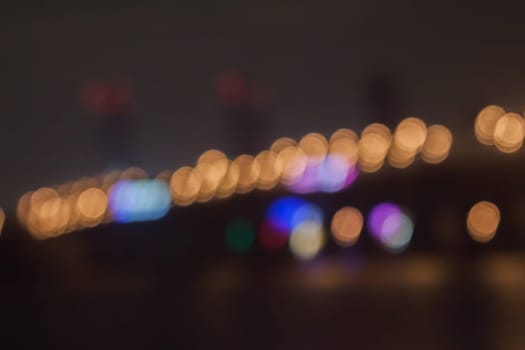 blurred street bokeh with warm colorful lights for background usage