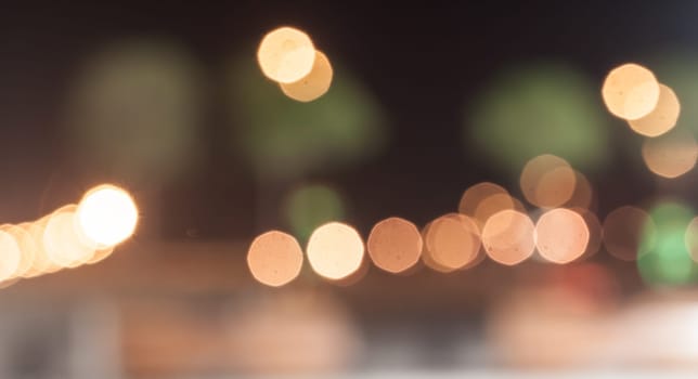 blurred street bokeh with warm colorful lights for background usage