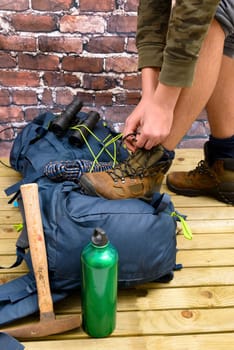 Hiking equipment, rucksack, boots and backpack. Concept for family hiking. Colorful background.
