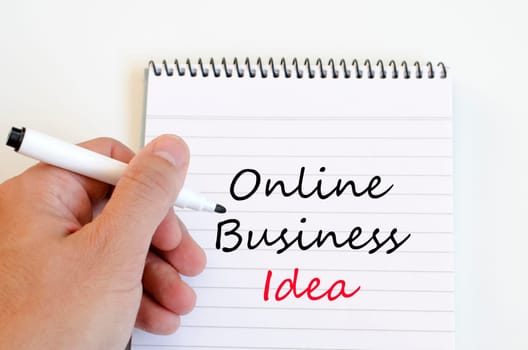 Online business idea text concept write on notebook