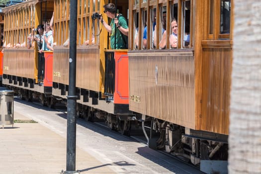Port De Soller,Spain - June 02,2016: Nostalgic train,tram on the beach promenade of the city of Soller in Spain. Opened in 1913 the route is about 5 km long. .