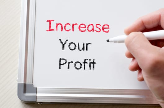 Human hand writing increase your profit on whiteboard