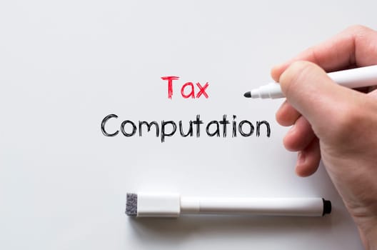 Human hand writing tax computation on whiteboard