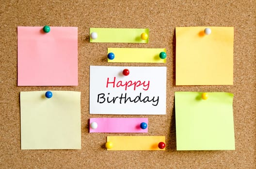 Sticky note on cork board background and text concept