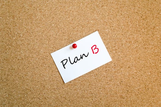 Sticky note on cork board background and text concept
