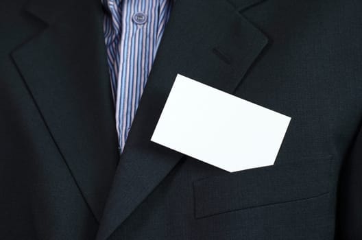 Business woman hand holding white empty note..