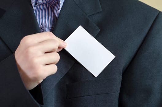 Business woman hand holding white empty note..