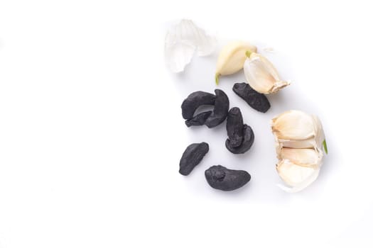 pile of black garlic, isolated on white
