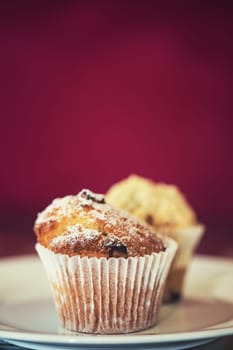 different muffins with fresh apples on white