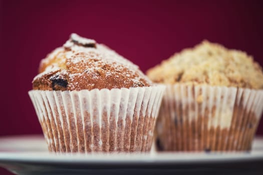 different muffins with fresh apples on white
