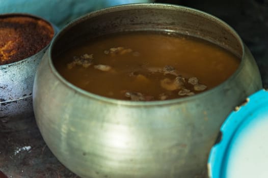 Cooking meals in a Russian stove, soup with meat and groats