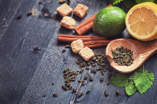 tea composition with cinnamon sticks, lemons