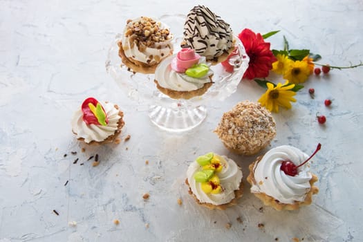 Different cakes composition on concrete background