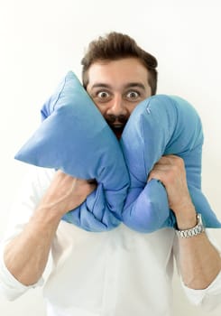 Crzy shocked surprised man with pillows