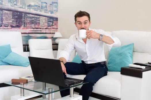 Happy energy man with cup of tea in the morning