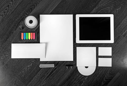 Corporate identity template on wooden table background. Photo of blank stationery set for placing your design. Top view.