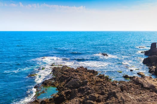 Black Sea coast. Bright sunny day. Picturesque seascape. Coastline with sea water.