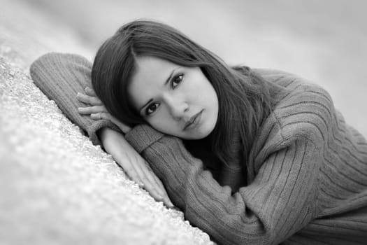 Unhappy girl with deep dark eyes look at the camera.Sad girl wondering about boy.Sad,thoughtful,unhappy,sorrowful,crying,troubled,worried,negative girl,woman with beautiful features,face,eyesight in big depression,despair lies and thinks of problems.
