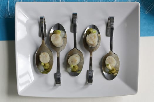 Top view of appetizers on a white plate