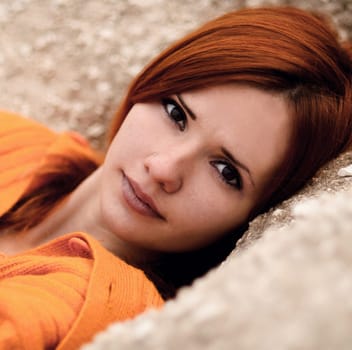 The portrait of very beautiful red-haired,cute,nice,attractive girl.Close-up portrait of red-haired,beautiful,attractive,gorgeous,stunning girl with healthy,pale,white skin,dark eyes,nice look.Red.