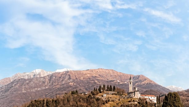 Mountain landscape with castle and belfry. Artegna Friuli Italy