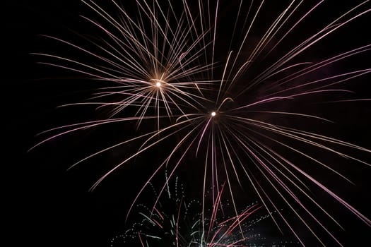 Colorful fireworks explosion in a dark night