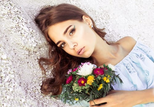 Beautiful girl with flowers
