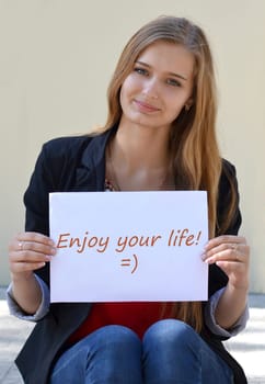 Beautiful,cheerful,smiling,light-haired girl with an inscription "Enjoy your life"",creative,colorful,blurred message,poster,typography,light design,vector,typographic,quote,art,decoration,your,life."