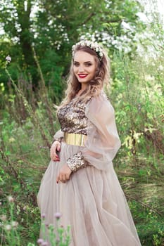 Beautiful smiling thinking girl with long white dress with loop standing outdoors in summer
