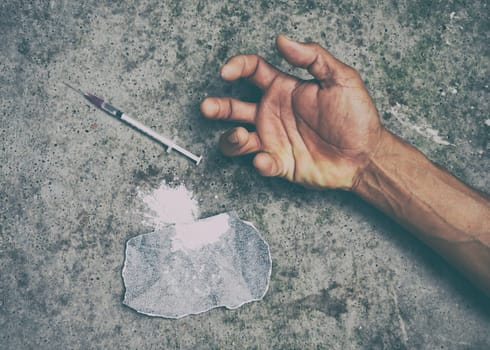 drug addict man with syringe in action
