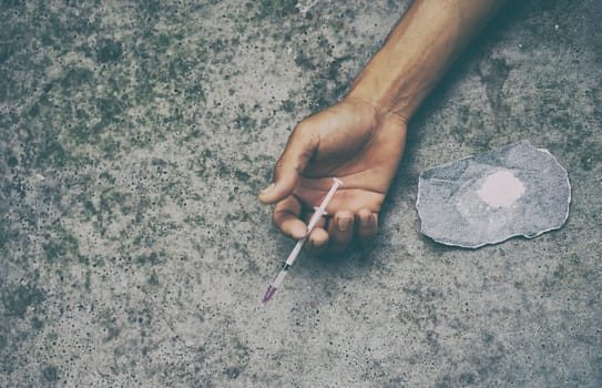 drug addict man with syringe in action
