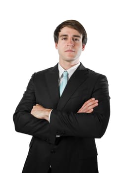 Upper body view of a young man around dark suit with crossed arms looking seriously into the camera.