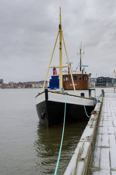 one old boat on a pier in Gothenburgs harbour
