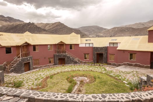CHIVAY, AREQUIPA, PERU - NOVEMBER 25, 2015: View of a traditional vintage hotel in Chivay, Arequipa Peru with clouds.
