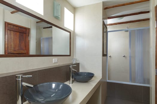 Bathroom with Cream Tiled Walls.