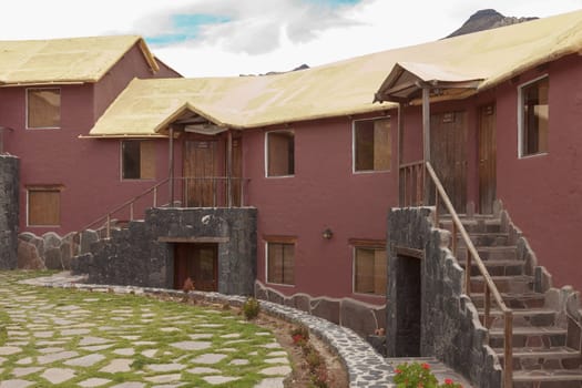 CHIVAY, AREQUIPA, PERU - NOVEMBER 25, 2015: A traditional vintage hotel in Chivay, Arequipa Peru with clouds.