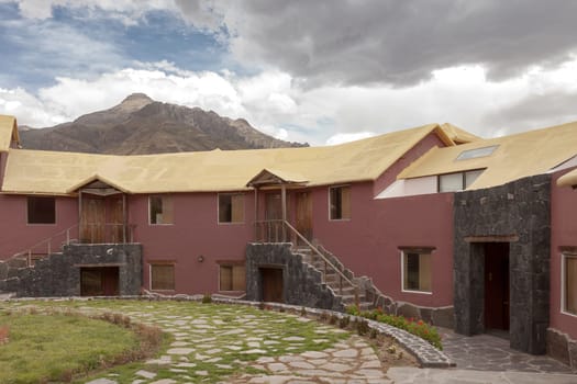 CHIVAY, AREQUIPA, PERU - NOVEMBER 25, 2015: A traditional vintage hotel in Chivay, Arequipa Peru with clouds.