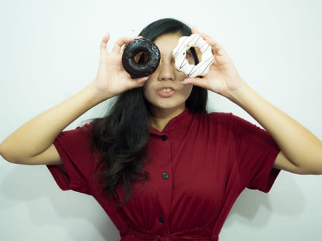 Asian woman holding donut on white background, red shirt, black long hair
