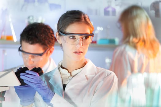 Life science researchers in scientific genetic laboratory.