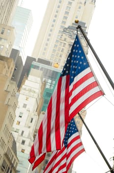 New York City, USA - September 26, 2012: .US flag in the background skyscrapers in Manhattan.