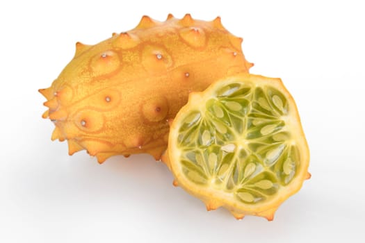 Whole and half kiwano fruit isolated on white background.