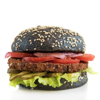 Black burger with beef meat cheese lettuce onion, tomato isolated on a white