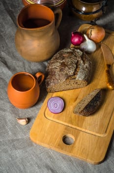 Top view on homemade bread and pottery