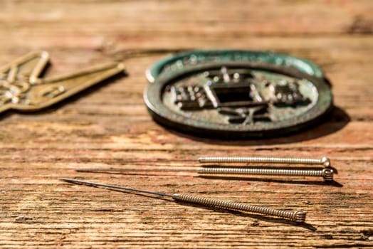 Acupuncture needles on Chinese,antique coin