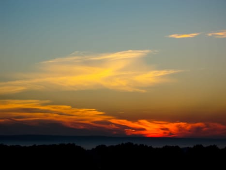 Sunset landscape. Horizon at sunset. Red black paint