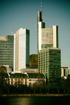 The skyline of the banking district in Frankfurt behind the river Main.