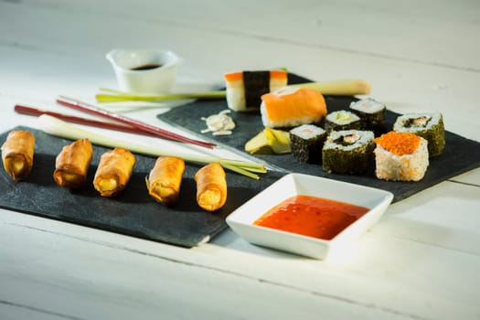Spring rolls and sushi